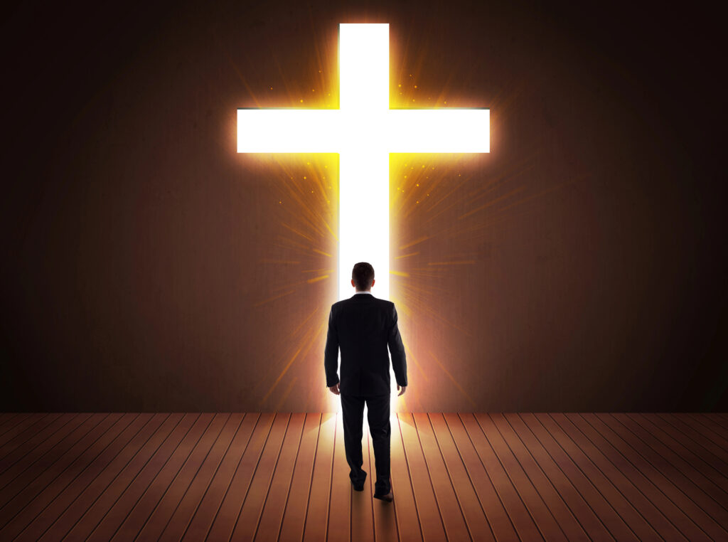 Depositphotos_101306000_XL Man looking at bright cross sign Author ra2studio